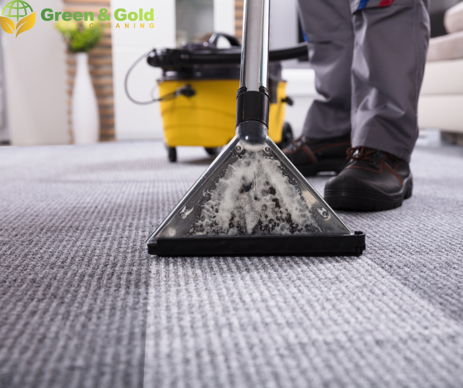 Professional cleaning a gray carpet with a commercial cleaning machine, 'Clean It All' logo visible in the background.